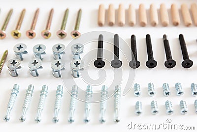 Assembling furniture, screws and dowels Stock Photo