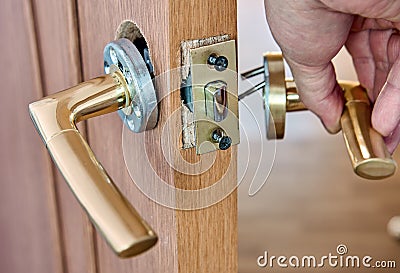Assembling lever door handle with latch for an interior door. Stock Photo