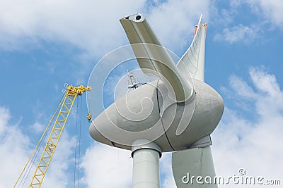 Assembling wings Dutch windturbine with large crane Stock Photo