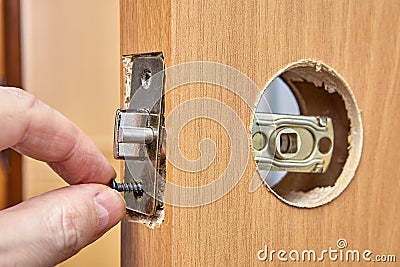 Assembly of door handle and installation lock with latch Stock Photo