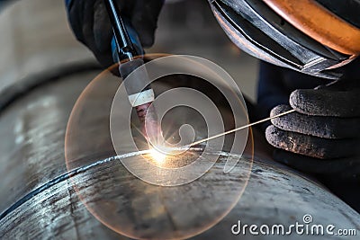 Welder, arc welding and weld seam close-up Stock Photo