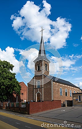 Assent, Limburg, Belgium - Church tower and street in the center of the village Editorial Stock Photo