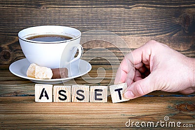 Asset. Wooden letters on the office desk, informative and communication background Stock Photo