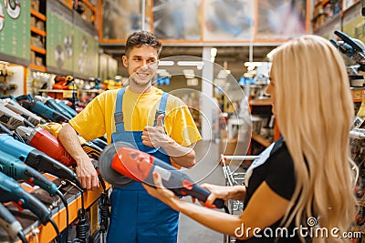 Assistant and female purchaser in hardware store Stock Photo