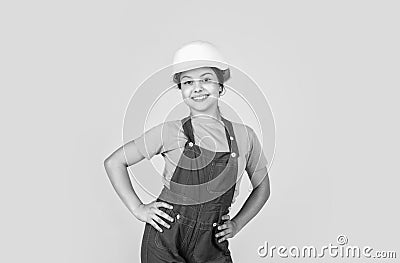 Assistant. Portrait of little girl with hard hat. Little girl in hard hat play in workshop. Child protection and safety Stock Photo