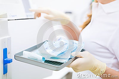 Assistant with sterile dentist tools Stock Photo