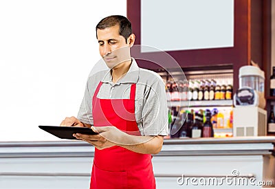 Assistant working at the cafe with tablet Stock Photo
