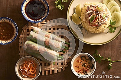 Assorted asian dinner, vietnamese food. Chicken rice, spring rolls Stock Photo