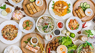 Assorted asian dinner, vietnamese food. Pho ga, pho bo, noodles, spring rolls top view Stock Photo