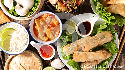 Spring roll, chinese soup, rice and fried noodles Stock Photo