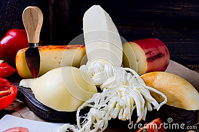 Assorted cheeses in various shapes and sizes Stock Photo