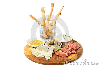 Assorted cheeses, wallnuts and other snacks Stock Photo