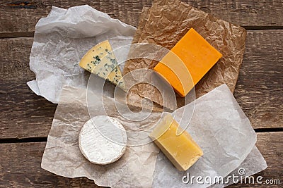 Assorted cheeses on the wooden table Stock Photo