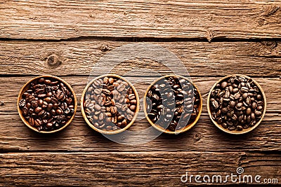 Assorted coffee beans on a driftwood background Stock Photo