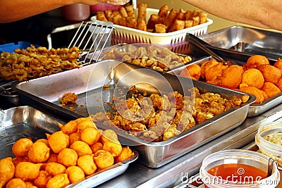 Assorted deep fried snack food sold at a food kiosk Stock Photo