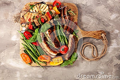 Assorted delicious grilled meat with vegetable on a barbecue. Grilled pork shish or kebab on skewers with vegetables . Food Stock Photo