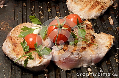 Assorted delicious grilled meat with vegetable over the coals on a barbecue in closeup Stock Photo