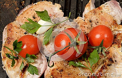 Assorted delicious grilled meat with vegetable over the coals on a barbecue in closeup Stock Photo