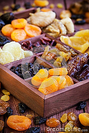 Assorted dried fruits in wooden box Stock Photo