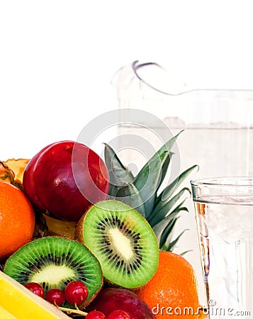 Assorted fruit and a glass of water Stock Photo