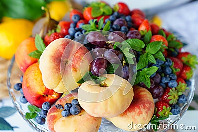 assorted fruits and berries on a plate. delicious and healthy vegetarian dessert Stock Photo