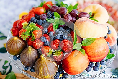 assorted fruits and berries on a plate. delicious and healthy vegetarian dessert Stock Photo