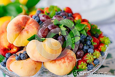 assorted fruits and berries on a plate. delicious and healthy vegetarian dessert Stock Photo