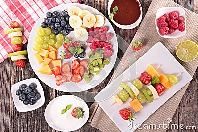Assorted fruits and dip Stock Photo