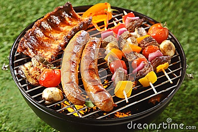 Assorted grilled meat on a summer barbecue Stock Photo