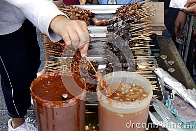 Assorted grilled pork innards such as intestine, liver, gizzard and blood in barbecue sticks Stock Photo