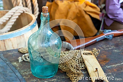 Assorted items sailor bottle on the background net and guns selective focus Stock Photo