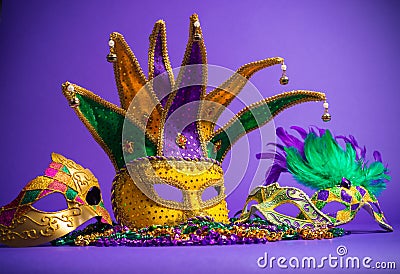 Assorted Mardi Gras or Carnivale mask on a purple background Stock Photo