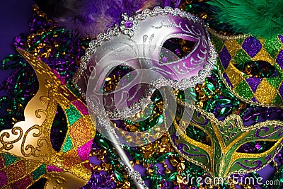 Assorted Mardi Gras or Carnivale mask on a purple background Stock Photo