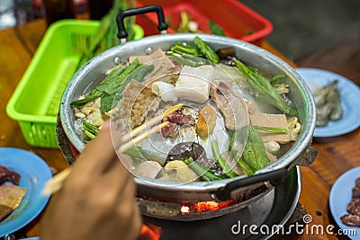 Assorted meat on Thai fire pot at restaurant Stock Photo