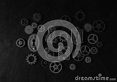 Assorted mechanical gears and vintage locks on dark background Stock Photo