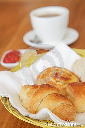 Assorted pastries, coffee and marmalade on the table Stock Photo