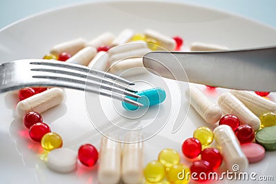 Assorted pharmaceutical medicine pills, tablets and capsules and Stock Photo