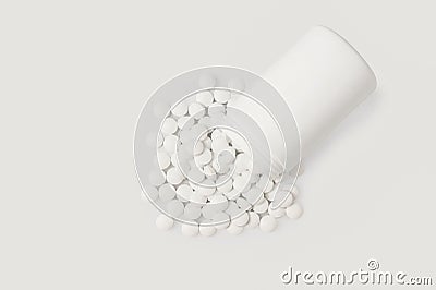 Assorted pharmaceutical medicine pills, tablets and capsules and bottle on white background Stock Photo