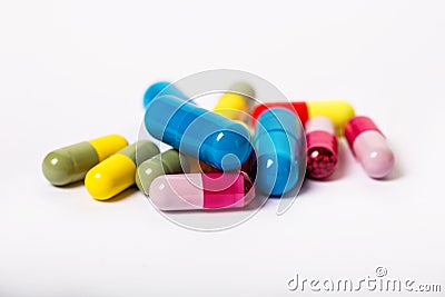 Assorted pharmaceutical medicine pills, tablets and capsules over black background Stock Photo