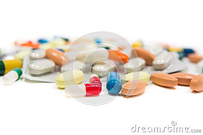 Assorted pharmaceutical medicine pills, tablets and capsules over white background Stock Photo