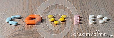 Assorted pharmaceutical tablets. The COVID word. Virus COVID-2019 concept word Stock Photo