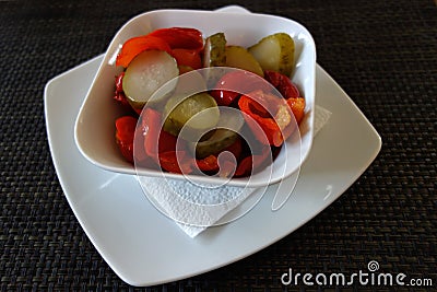 Assorted pickles sprinkled with apple vinegar and olive oil Stock Photo