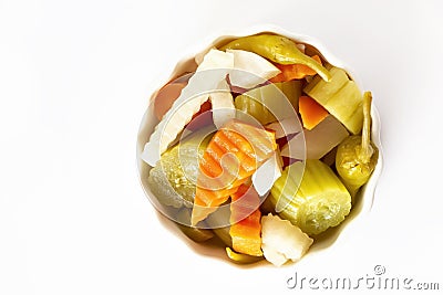 Assorted pickles vegetables carrot, chili, radish in white ceramic bowl. Top view. Isolated. Copy space. Top view Stock Photo