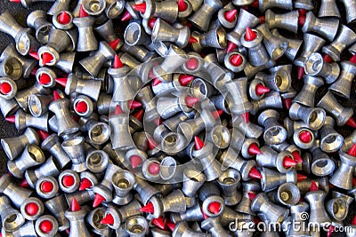 Pile of .177 calibre red tipped lead air rifle pellets Stock Photo