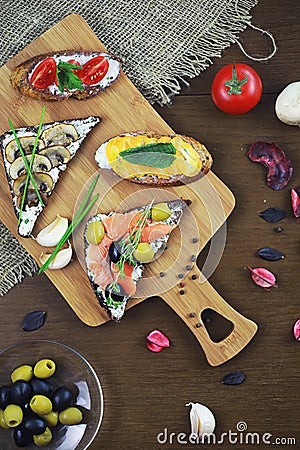 Assorted sandwiches with different fillings, fish mushrooms and Stock Photo