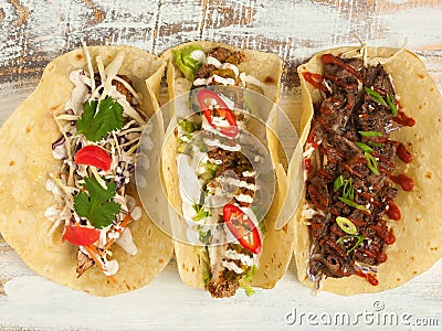 Assorted tacos: chicken, beef and pork with vegetables Stock Photo