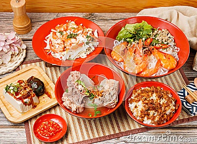 Assorted taiwan food Salad with Fresh Shrimp, Braised Pork Rice, Stewed Pork Ribs Noodles, preserved egg tofu, in a bowl with Stock Photo