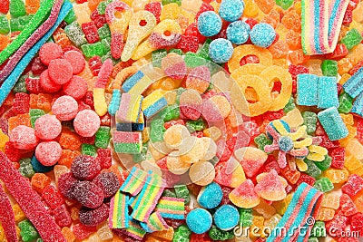 Assorted variety of sour candies includes extreme sour soft fruit chews, keys, tart candy belts and straws Stock Photo