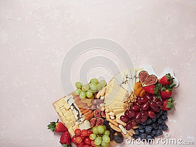 Assortment appetizers and snacks: cheese and fruit platter Stock Photo