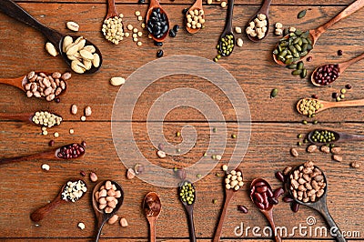 Assortment of beans and lentils in wooden spoon Stock Photo